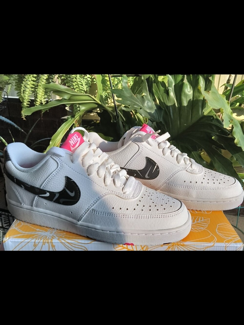Nike Women's White Low-Top Sneakers with Black Swoosh